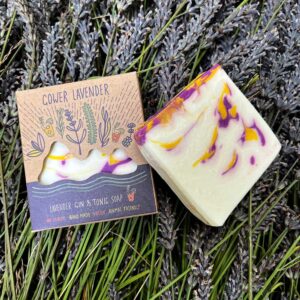 Lavender gin and tonic soap shown on a background of Gower lavender